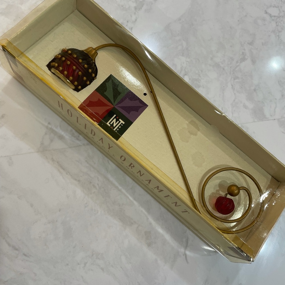 Holiday ornament candle snuffer